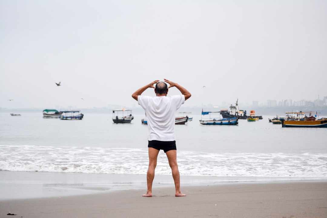 man standing on seashore